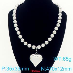 Fashionable stainless steel perforated steel ball necklace paired with hollow heart pendant - KN291764-Z
